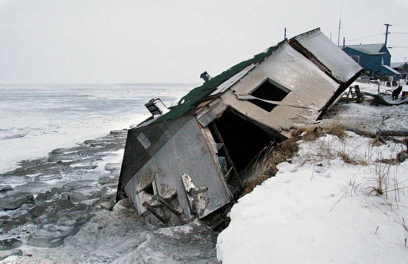 n this Dec. 8, 2006 photo, Nathan Weyiouanna's abandoned house at the west end of Shishmaref, Alaska, sits on the beach after sliding off during a fall storm in 2005. Like some other Alaska villages, the Inupiat Eskimo community is facing an expensive relocation because of erosion, which is eating away at the current site on a narrow island just north of the Bering Strait. The community will hold a special election Aug. 16, 2016, asking residents if they should develop a new community at a nearby location or stay put with added protections.